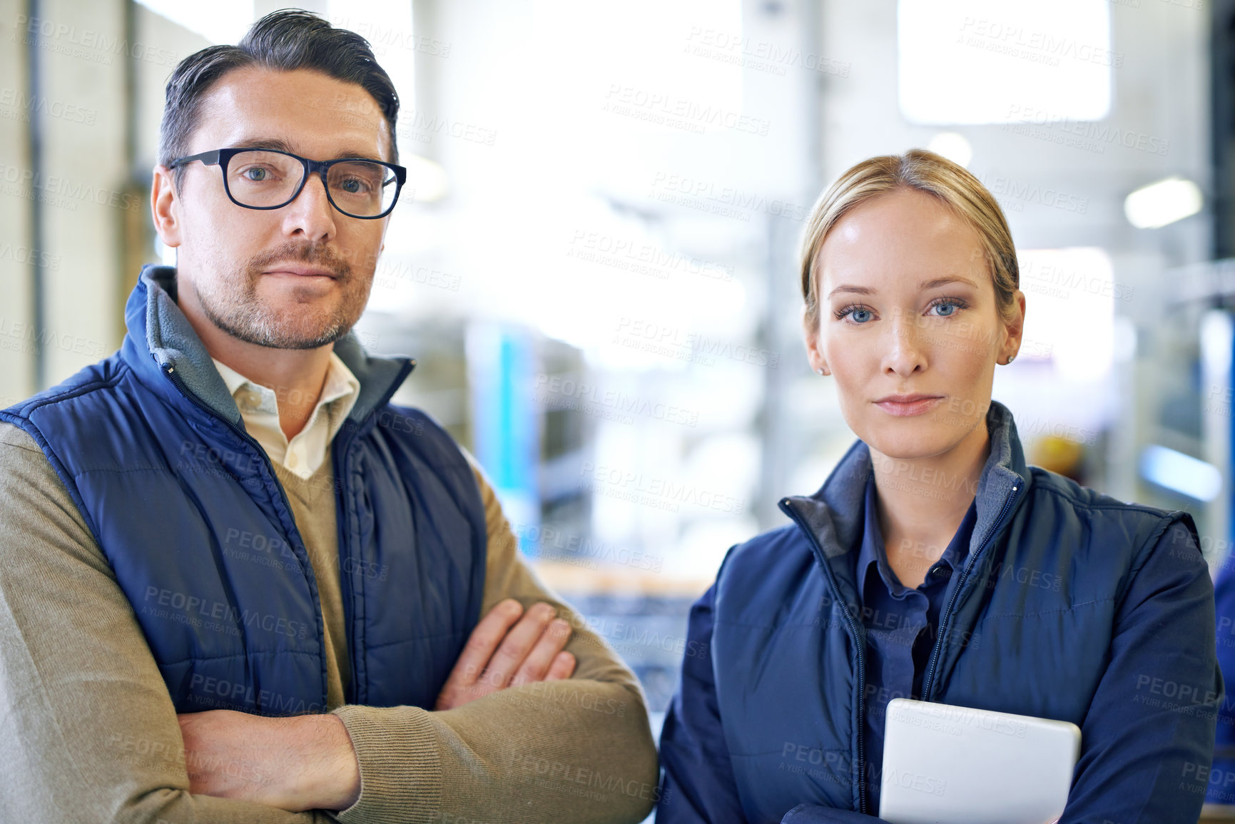 Buy stock photo Colleagues, man and woman with tablet, portrait and serious for delivery in warehouse of factory. Teamwork, girl and male person in collaboration for shipping or manufacturing of goods in workplace