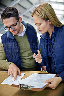 Buy stock photo Business people, reading and checking inventory with storage in supply chain at warehouse. Logistic coworkers, team or employees looking at documents, paperwork or clipboard for distribution factory