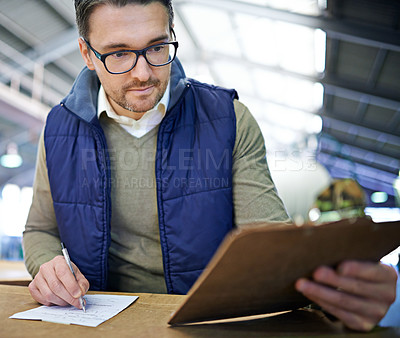 Buy stock photo Manager man, glasses and clipboard in logistics warehouse for inspection or inventory checkup. Male supervisor, writing and label packages in freight factory for shipping or distribution of goods.