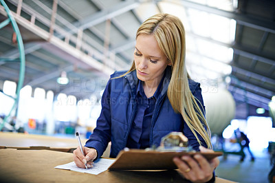 Buy stock photo Business people, writing and reading with inventory checklist for clipboard, storage or supply chain at warehouse. Female person or employee with documents or paperwork for distribution at factory