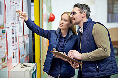 Buy stock photo People, business and checking schedule with board in warehouse with calendar for order details. Man, woman and together with checklist or clipboard for supplier information and inventory updates