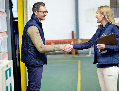 Buy stock photo Business people, shaking hands and welcome for partnership, collaboration and agreement. Professional, clipboard and handshake for introduction, b2b onboarding or teamwork in shipping warehouse