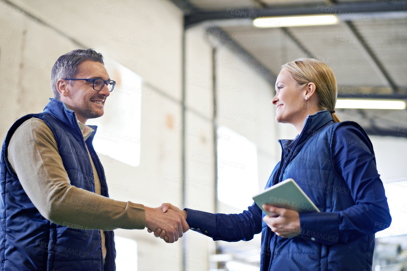 Buy stock photo Welcome, deal and business people with handshake for partnership, distribution or agreement. Professional, technology and shaking hands for export support, b2b networking or onboarding in warehouse