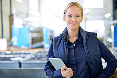 Buy stock photo Portrait of an attractive young female worker in a warehouse