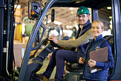 Buy stock photo Cropped shot of a two coworkers managing a warehouse