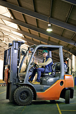 Buy stock photo Man, forklift and driving in warehouse for site inspection, management and supply chain industry. Male employee, hardhat and operating machinery for factory check up, freight export and services.