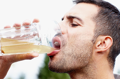 Buy stock photo Man, drinking and healthy probiotic juice for natural, organic and refreshing liquid for energy. Male person, hydrate and glass of beverage with sodium for health, wellness and nutrients for vitamins