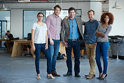 Buy stock photo Portrait of a group of colleagues standing in a modern office