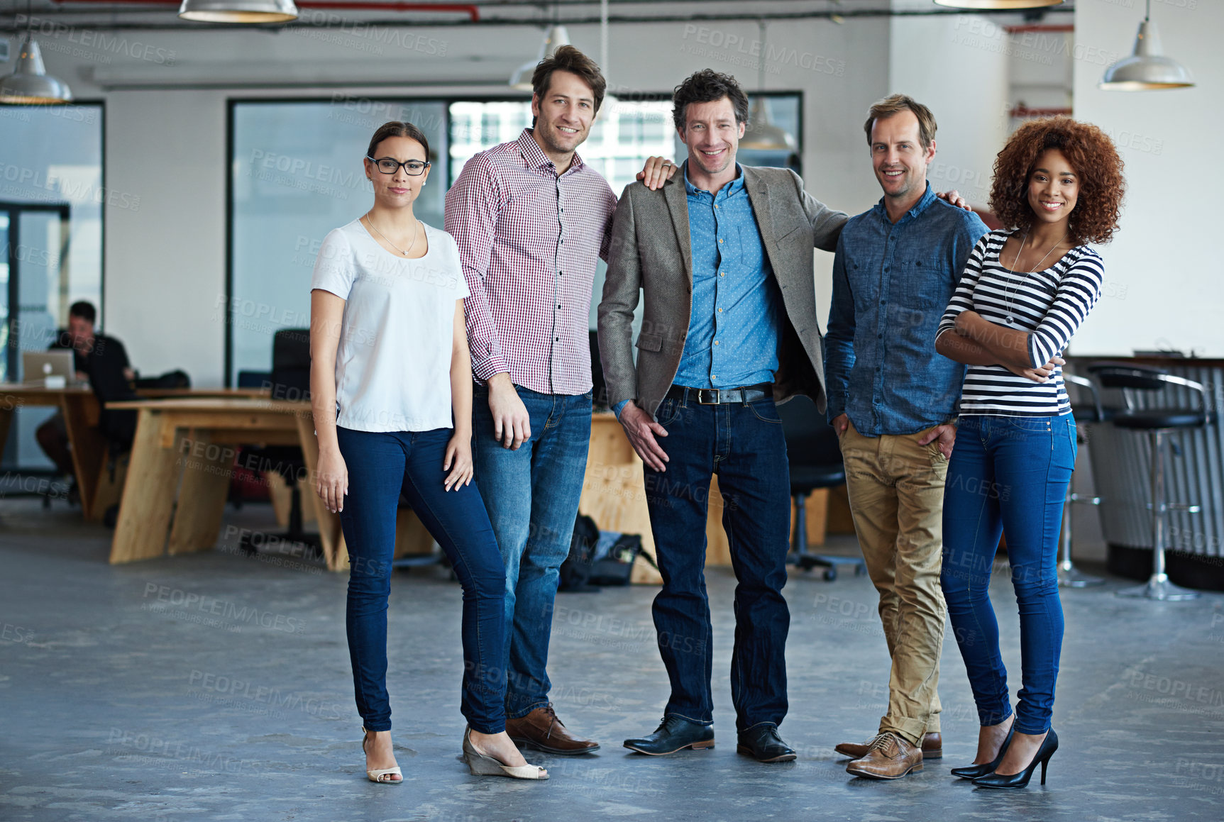 Buy stock photo Portrait of a group of colleagues standing in a modern office