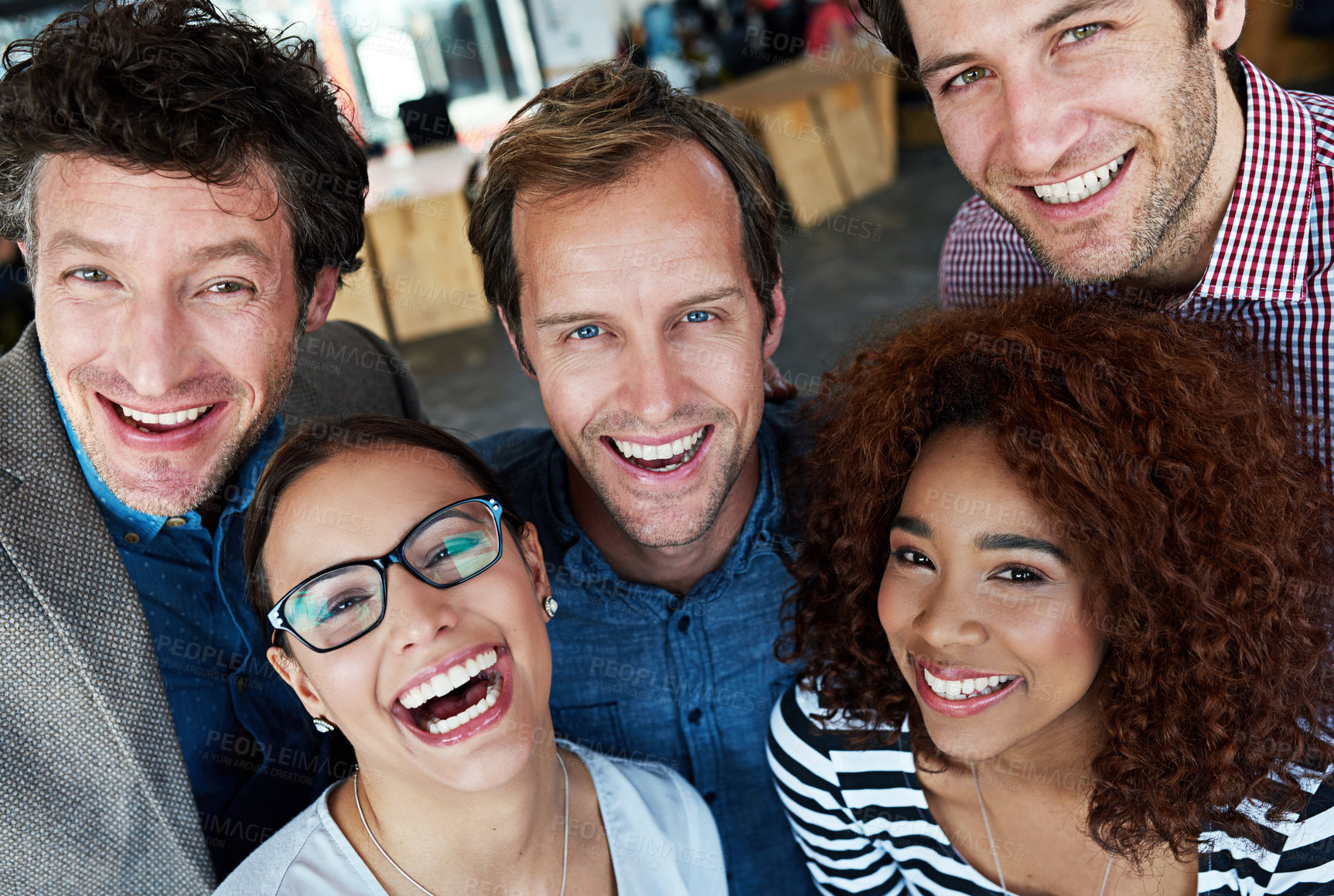 Buy stock photo Portrait of a group of ecstatic colleagues in an office