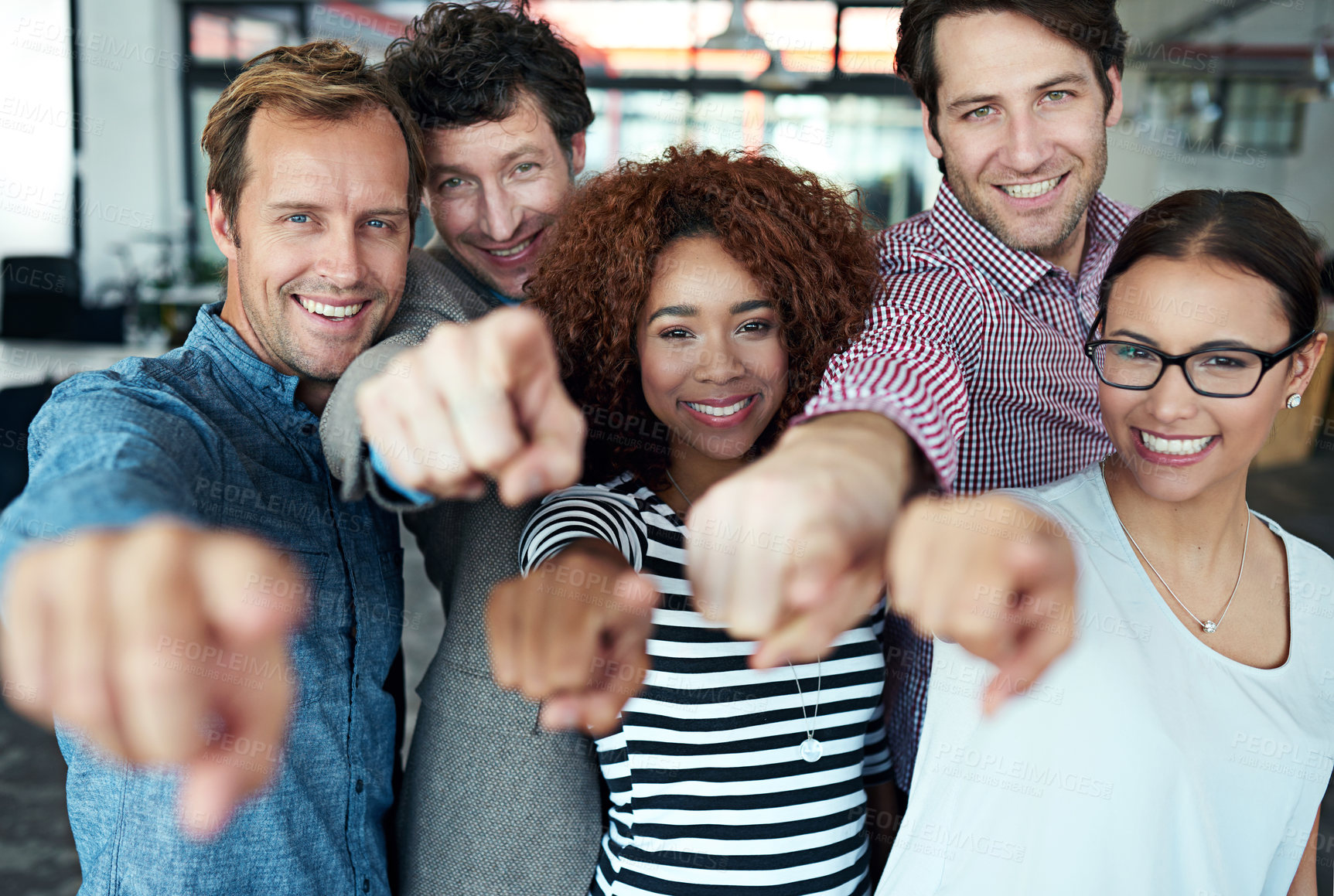 Buy stock photo Portrait of a group of office colleagues pointing at the camera