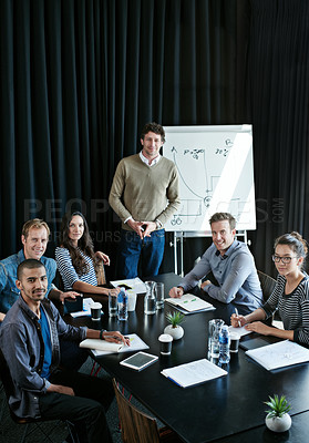Buy stock photo Portrait of a diverse group of colleagues sitting together in a boardroom presentation