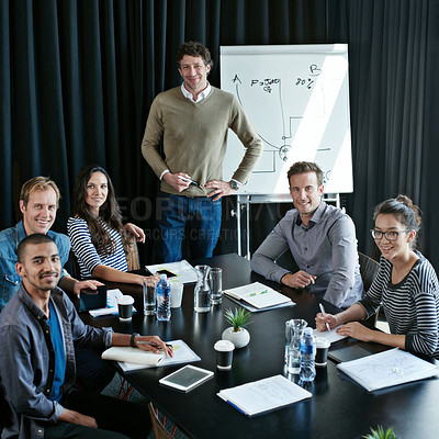 Buy stock photo Portrait of a diverse group of colleagues sitting together in a boardroom presentation