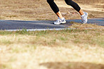 Running woman's legs in motion