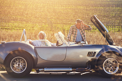 Buy stock photo Senior couple, car and problem by road with sunshine for vacation, roadtrip and assistance. Mature people, engine check and countryside with transport for emergency, journey and together in France