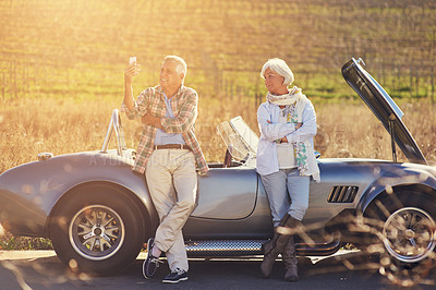 Buy stock photo Senior people, emergency and phone outdoor with sunshine for no service, roadtrip and assistance. Mature couple engine check and countryside with transport for problem, journey and together in France