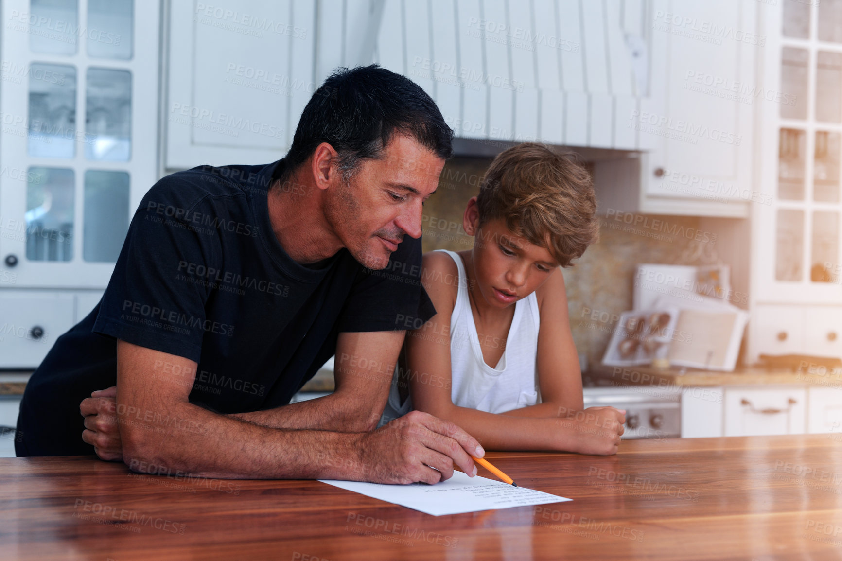 Buy stock photo Cropped shot of a father going over a list of chores with his son at home
