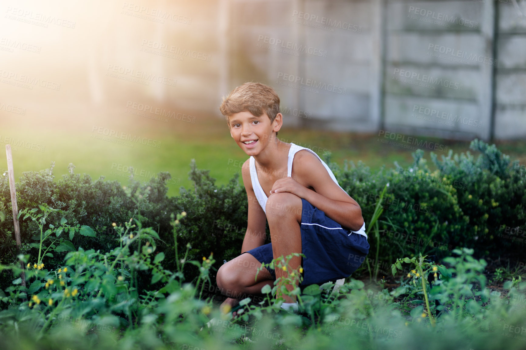Buy stock photo Portrait of a young boy gardening outside