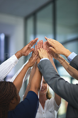Buy stock photo Shot of a group of unrecognizable businesspeople with their hands in a huddle