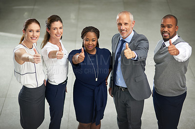 Buy stock photo High angle portrait of a group of businesspeople pulling thumbs up