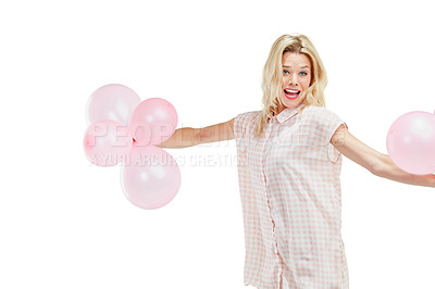 Buy stock photo Studio portrait of an excited young woman celebrating with pink balloons against a white background