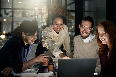 Buy stock photo Shot of a group of young designers working late in the office