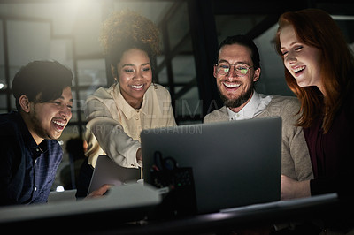 Buy stock photo Shot of a group of young designers working late in the office