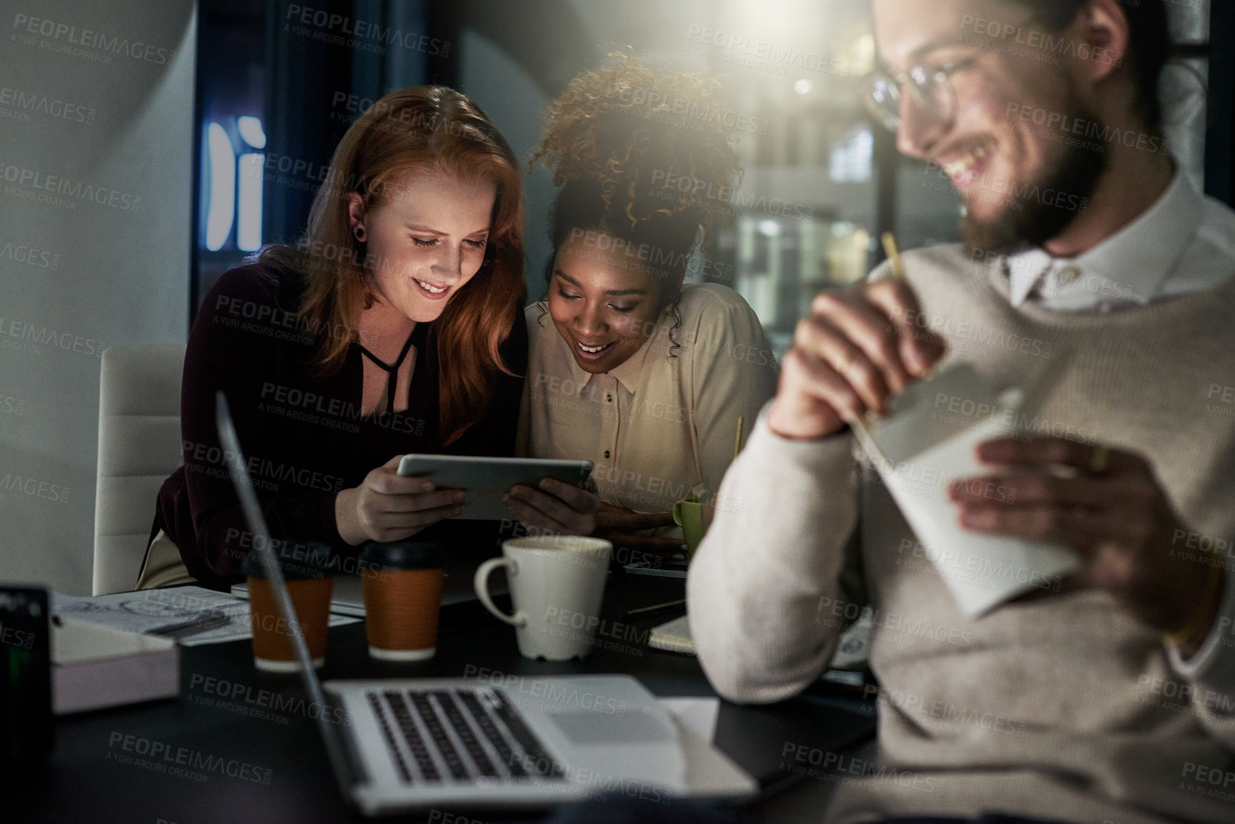 Buy stock photo Technology, teamwork and night with business people working late on a deadline in their office. Collaboration, diversity and project management with an employee team at work in the dark for overtime