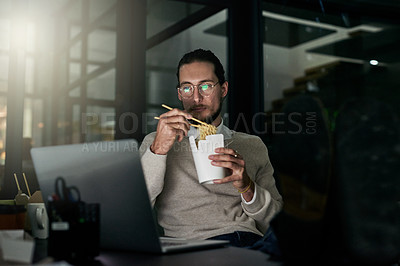 Buy stock photo Laptop, noodles and business man eating in office at night while finishing project. Ramen break, chinese food and male employee eat takeaway dinner while reading email on computer in dark workplace.