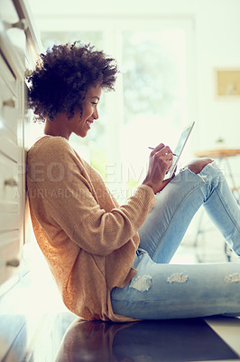 Buy stock photo Woman, tablet and home on floor for relax, networking and social media news or browsing on web for communication on floor. Living room, happy and smile for internet search, comfort and house