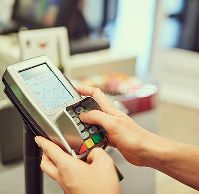 Buy stock photo Closeup shot of a person typing their pin number into a credit card machine at a grocery store