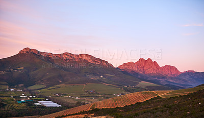 Buy stock photo Nature, sunset and mountain countryside for horizon, peace and location of sustainable environment. Skyline, calm and dusk in outdoor for tourism aesthetic, travel and color in clouds for ecosystem