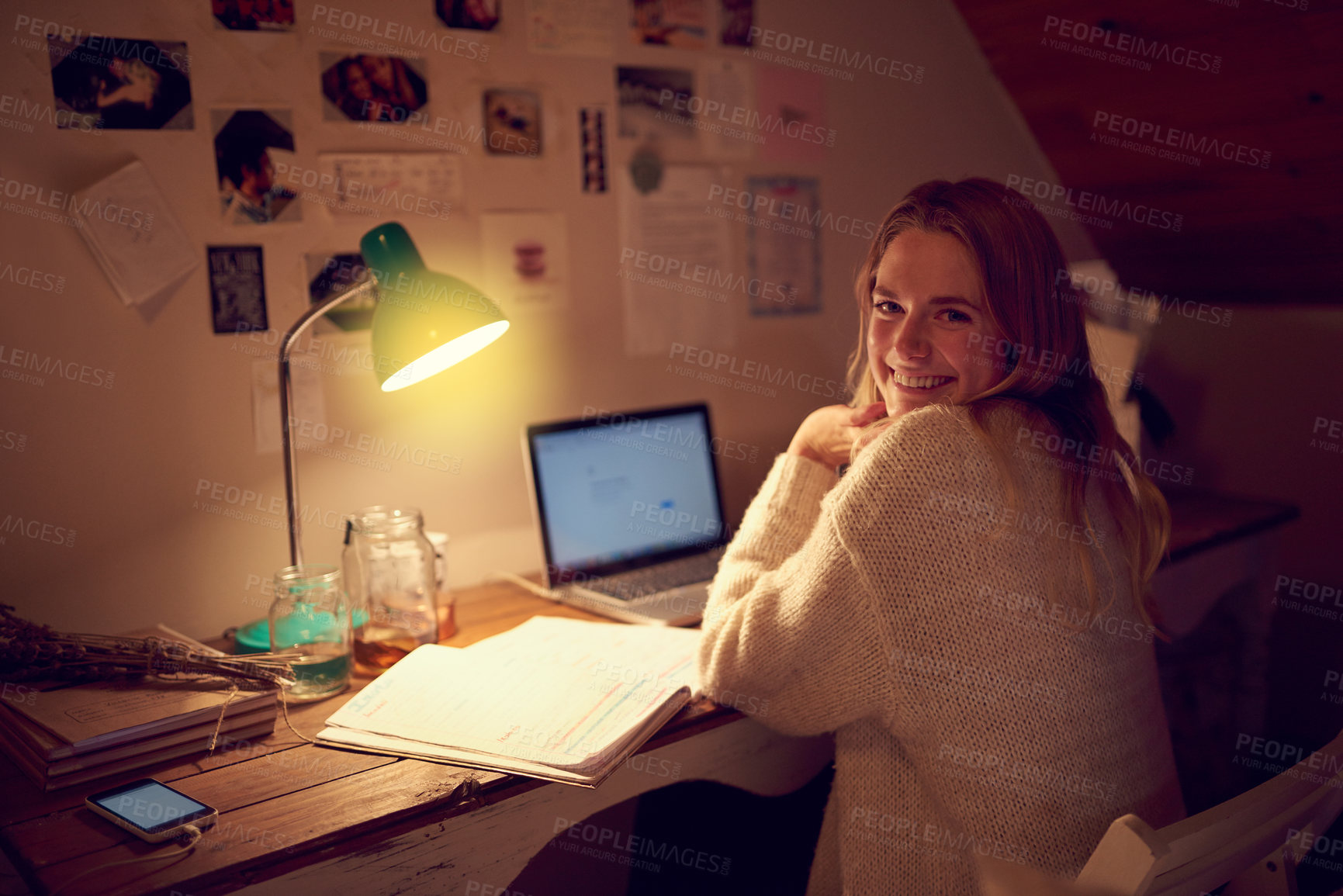 Buy stock photo Portrait of a young woman using her laptop in her bedroom at night