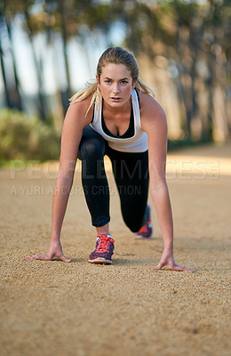 Buy stock photo Portrait of an attractive young woman exercising outdoors