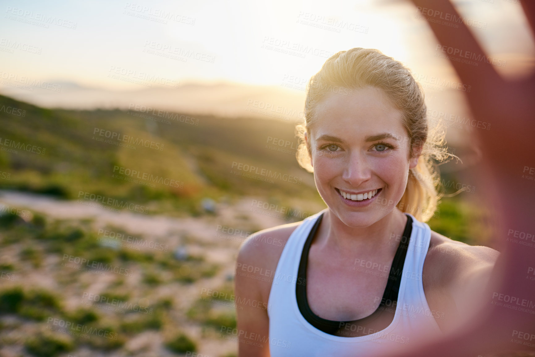 Buy stock photo Shot of an attractive young woman taking a selfie while exercising outdoors