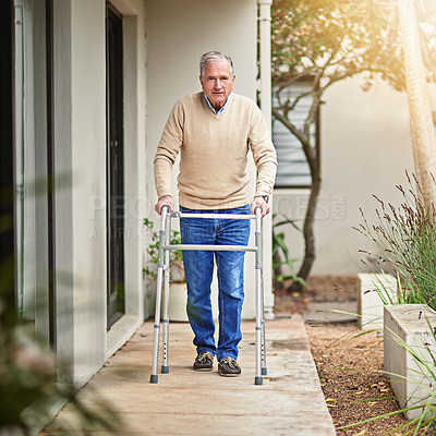 Buy stock photo Portrait of a senior man taking a stroll outside with his walker