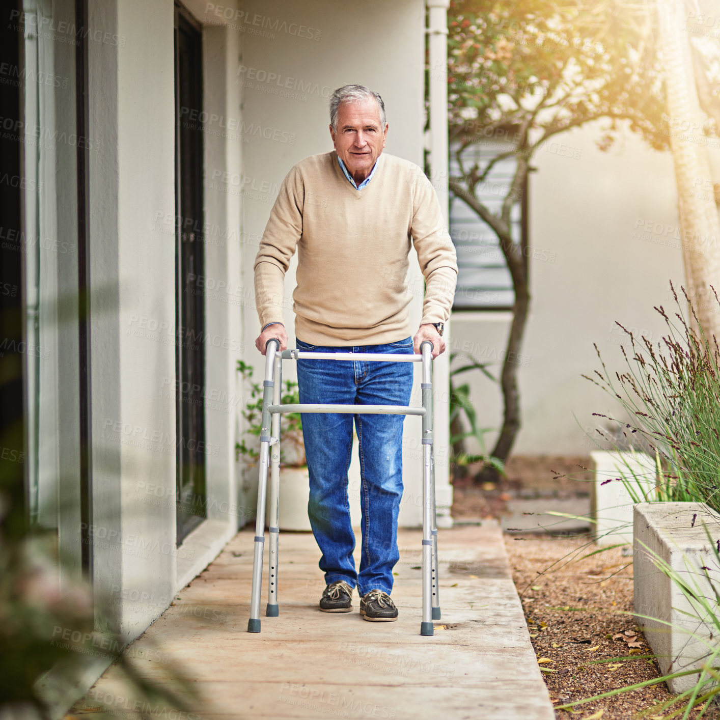 Buy stock photo Portrait of a senior man taking a stroll outside with his walker