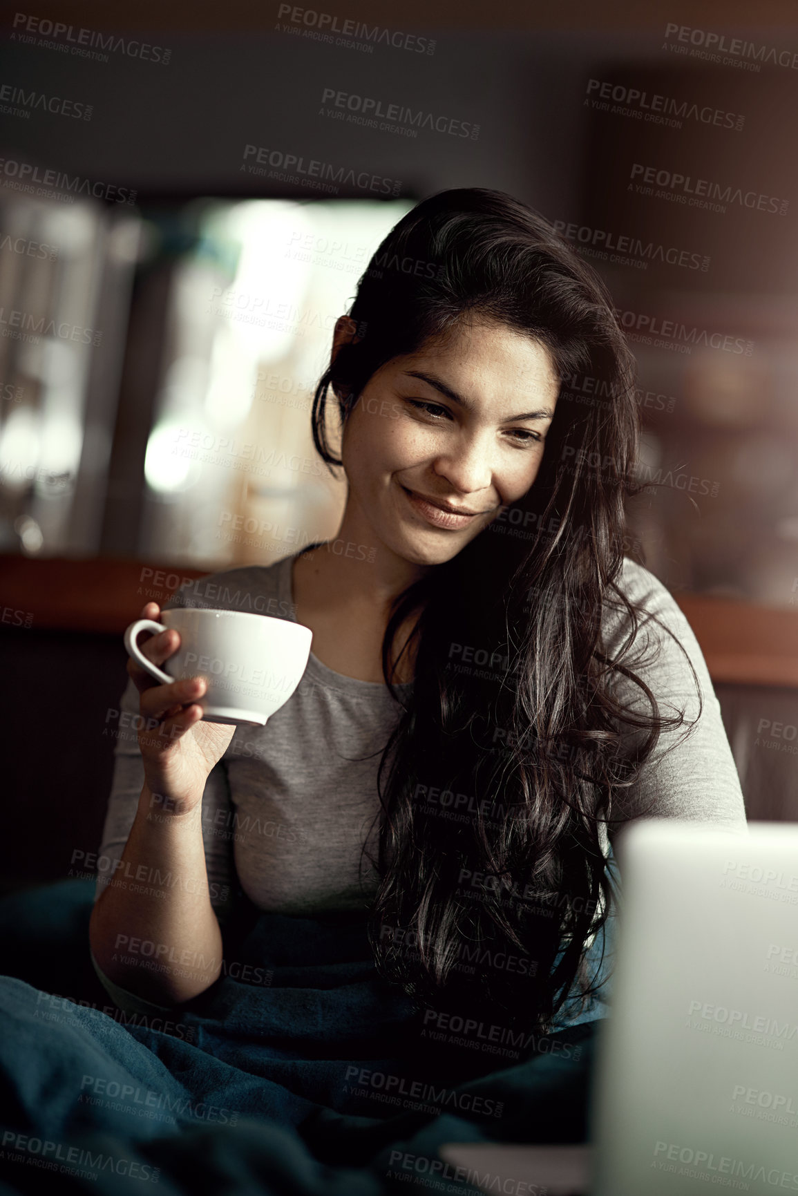 Buy stock photo Happy, woman and cup of coffee with laptop for morning entertainment on weekend or online blog read. Female person, smile and beverage in hand for relax in home, internet search and streaming