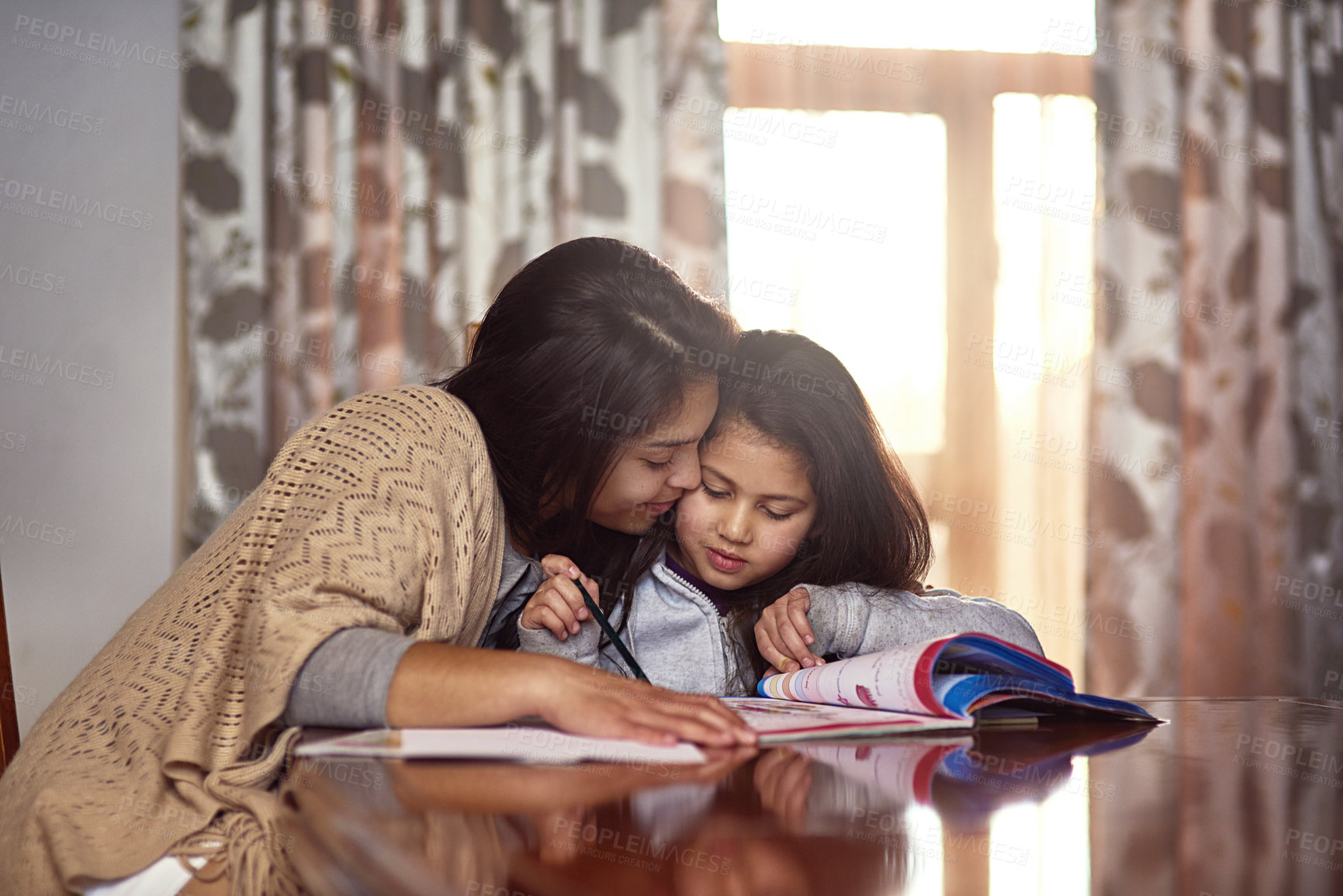 Buy stock photo Mother, kid and homework with book on table for learning, knowledge or support in education. Happy, family and woman with girl in house for child development, homeschool and help with studying