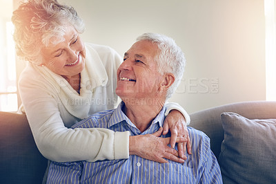 Buy stock photo Cropped shot of a senior couple relaxing at home