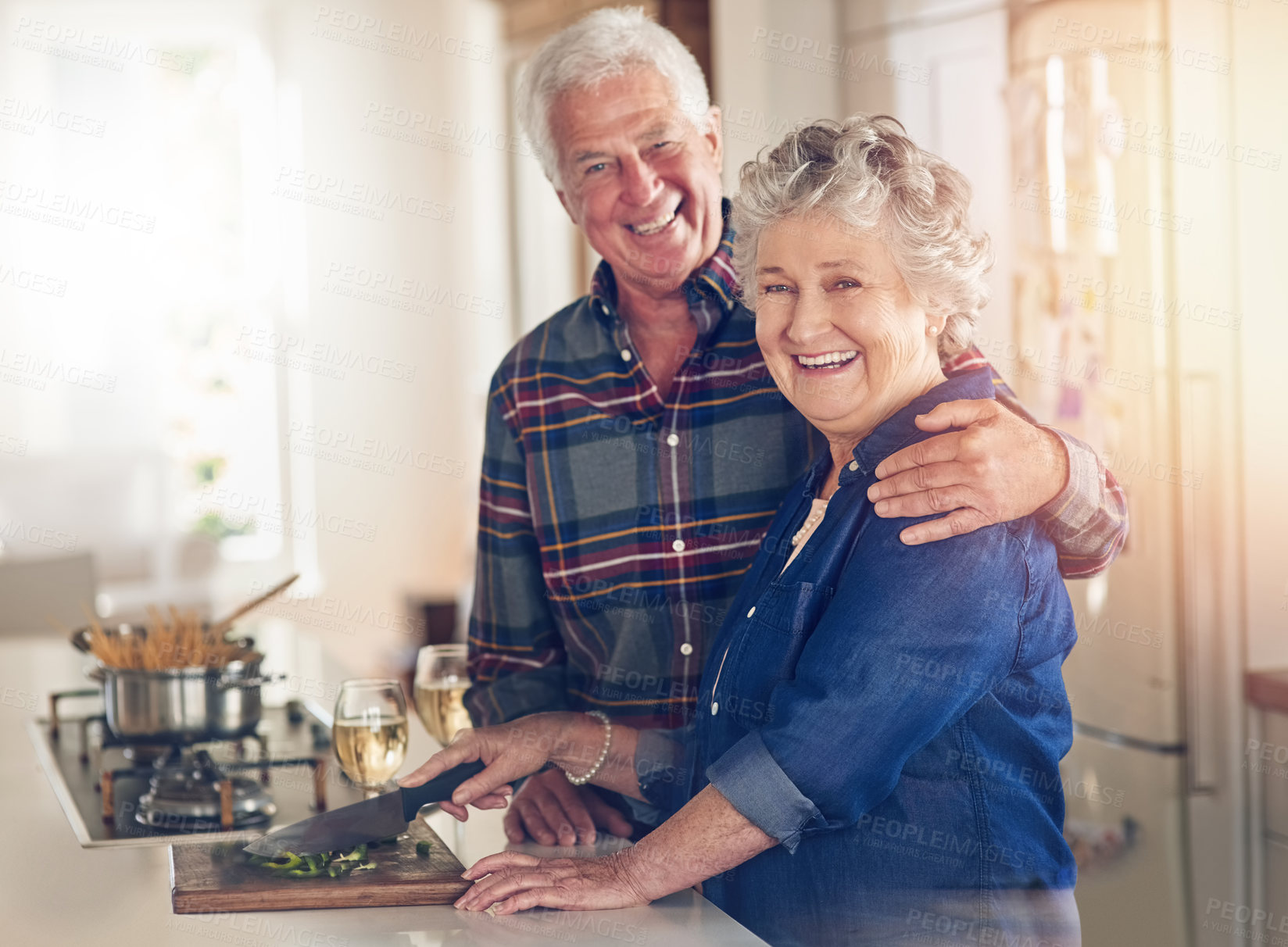 Buy stock photo Portrait, food and cooking with old couple in kitchen for nutrition, bonding and health. Pasta, retirement and vegetables with senior man and woman helping at home for meal prep, love and wellness