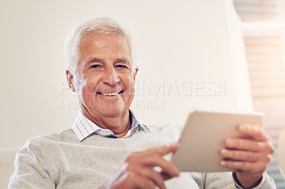Buy stock photo Portrait of a senior man using a digital tablet at home