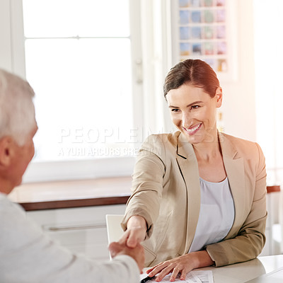 Buy stock photo Cropped shot of a senior man meeting with his financial consultant