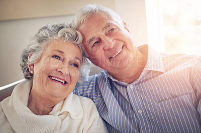 Buy stock photo Cropped shot of a senior couple looking thoughtful at home