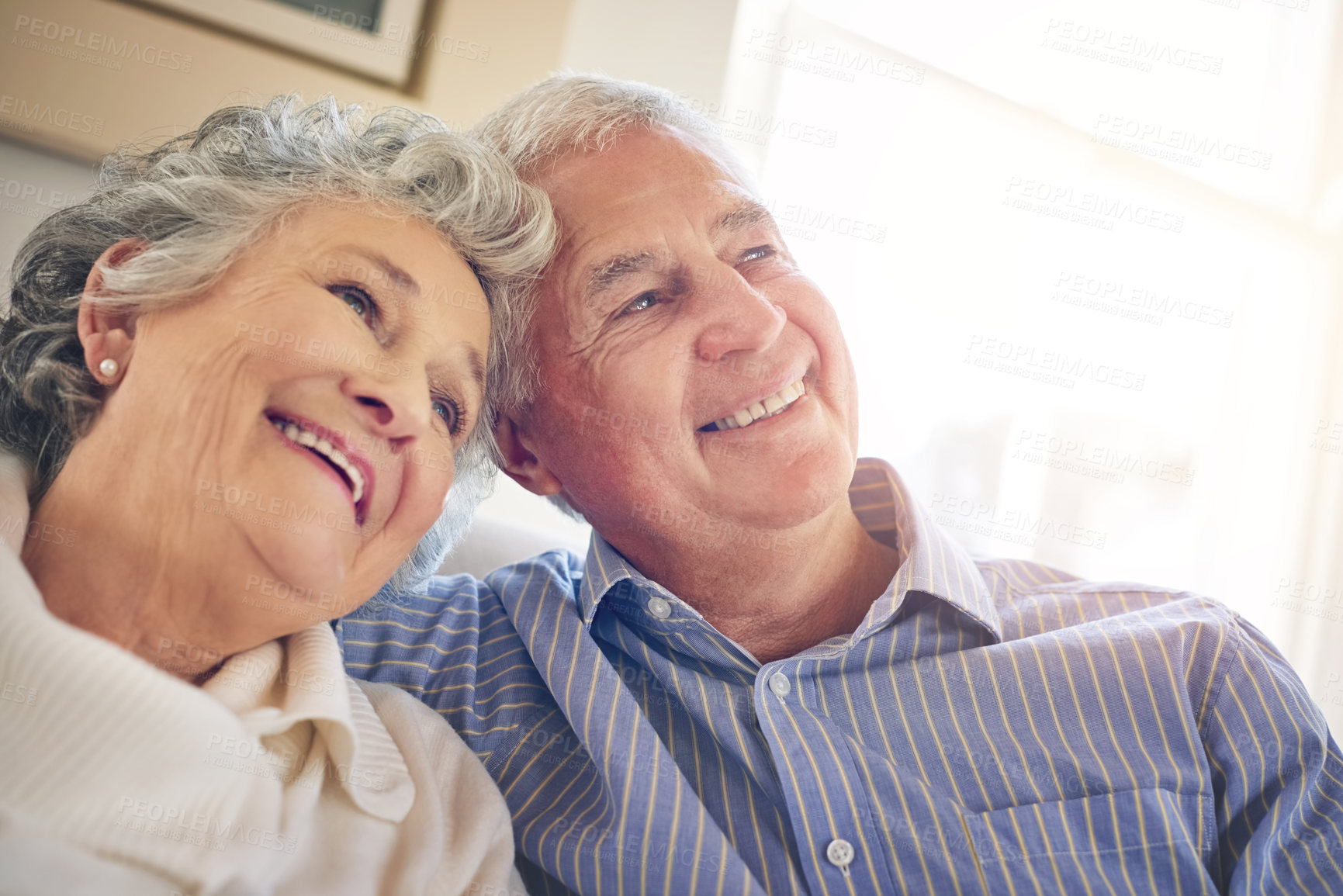 Buy stock photo Cropped shot of a senior couple looking thoughtful at home