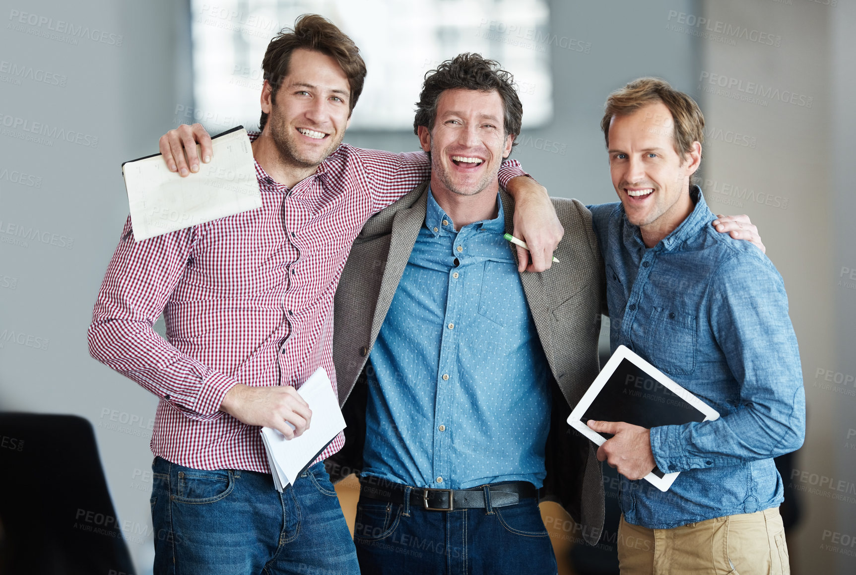 Buy stock photo Team, portrait or business developers hug after meeting for support in office together with smile or unity. Confident men, people or happy programmers with technology, notes or notebook in workplace