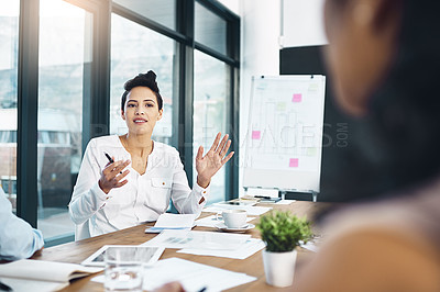 Buy stock photo Creative, business woman and team discussion in meeting, planning or brainstorming startup ideas in office. Financial advisor, group and collaboration on project strategy, graph and data analysis