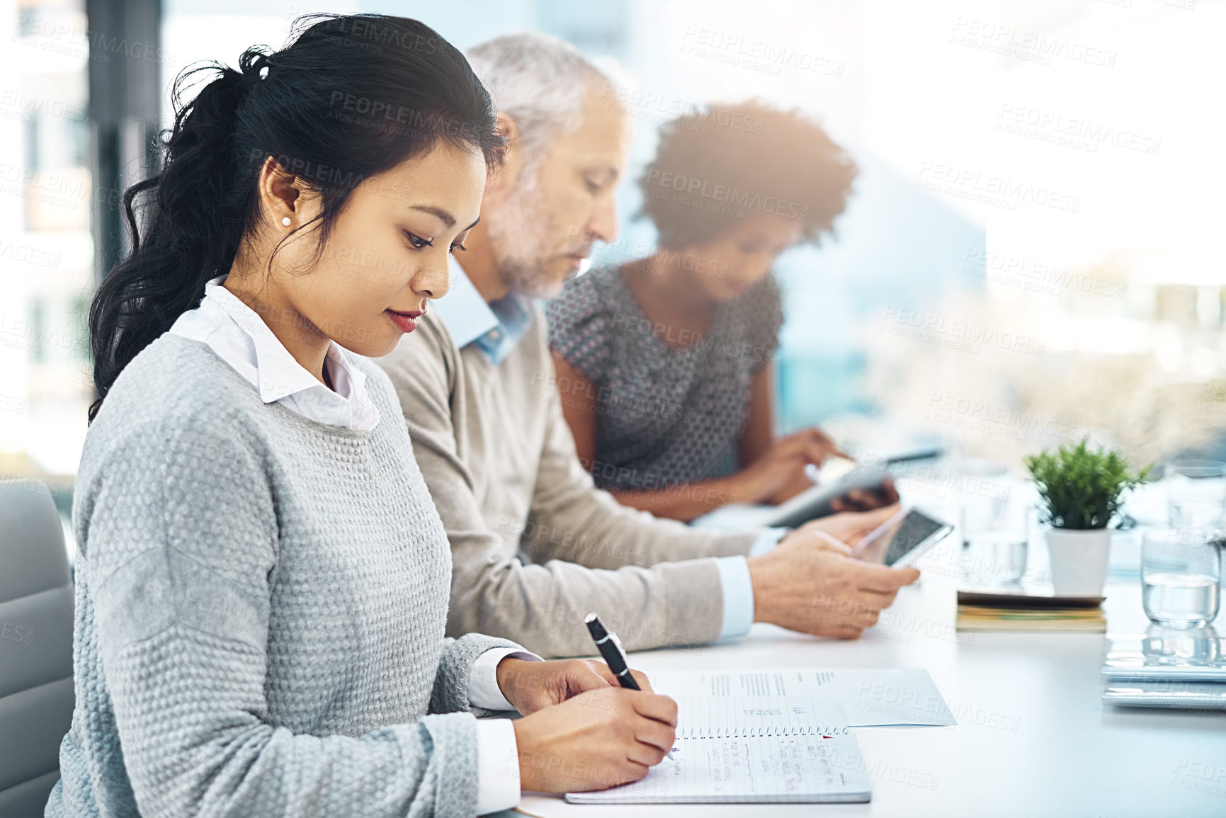 Buy stock photo Shot of a group of colleagues working in an office