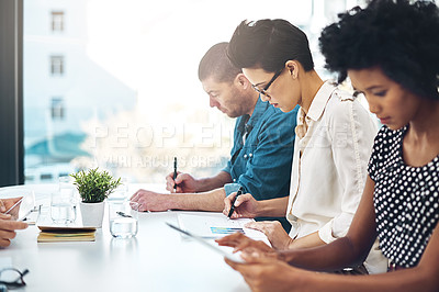 Buy stock photo Shot of a group of colleagues working in an office