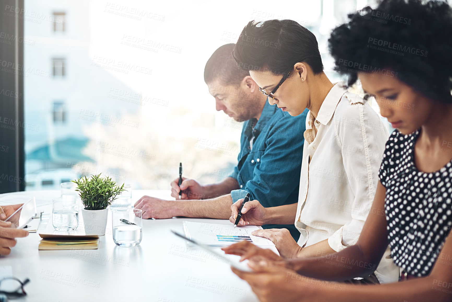 Buy stock photo Business people, meeting and writing notes in office for collaboration, brainstorming or sharing ideas. Teamwork, employees or colleagues working together in boardroom for support and planning